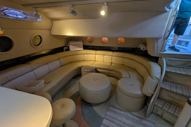Slide: The Image of Luxurious interior of a 1994 Sea Ray 500 Sundancer yacht with beige leather seating. - 26