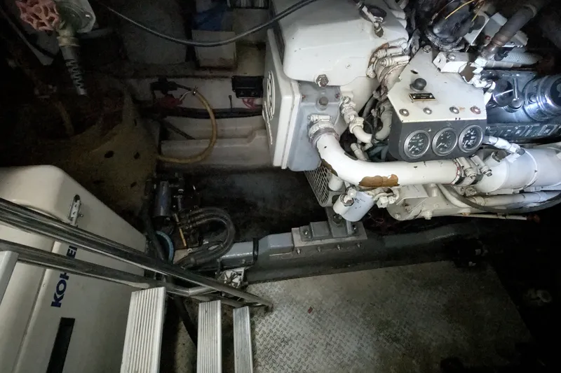 Slide: The Image of Engine room of a 1994 Sea Ray 500 Sundancer with visible gauges and machinery. - 46