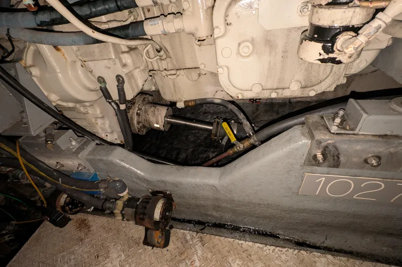 Slide: The Image of Engine compartment of a 1994 Sea Ray 500 Sundancer boat, showing mechanical components. - 47