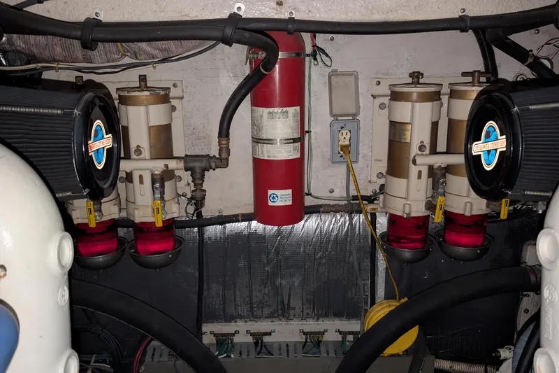 Slide: The Image of Engine room of a 1994 Sea Ray 500 Sundancer with fuel filters and fire extinguisher. - 50