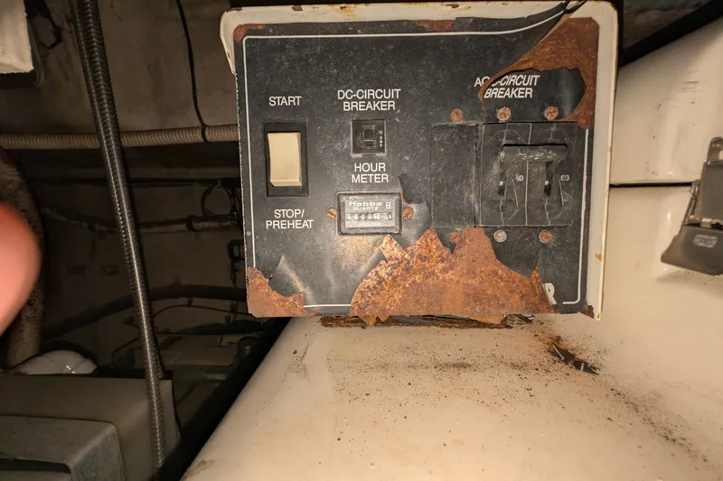 Slide: The Image of Rusted control panel of a 1994 Sea Ray 500 Sundancer boat. - 52