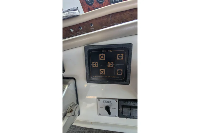 Slide: The Image of Control panel of a 1994 Sea Ray 500 Sundancer boat, featuring URC-100 system. - 58