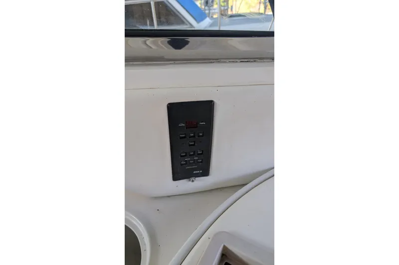 Slide: The Image of Control panel on a 1994 Sea Ray 500 Sundancer yacht dashboard. - 60