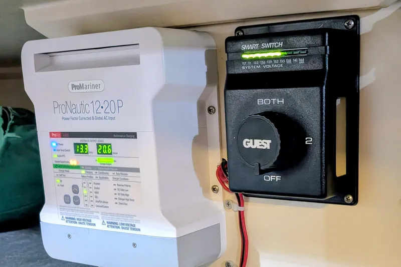 Slide: The Image of Battery charger and switch panel on a 1990 Catalina Capri 26 sailboat. - 10