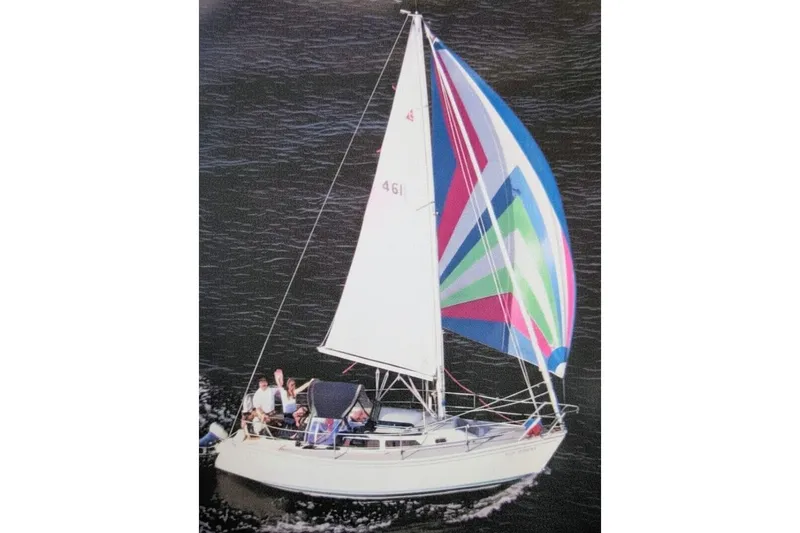 Slide: The Image of Sailing Catalina Capri 26, 1990 model, with colorful spinnaker on open water. - 3