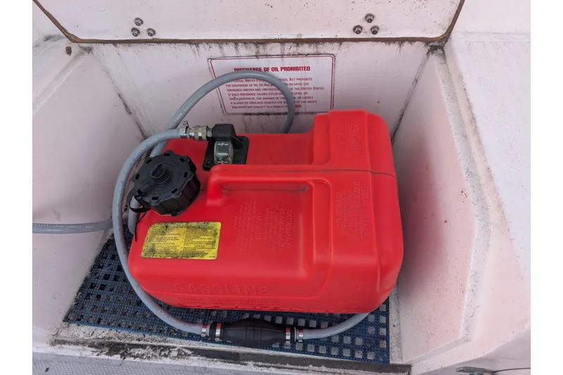 Slide: The Image of Red gasoline container in a 1990 Catalina Capri 26 boat compartment. - 37