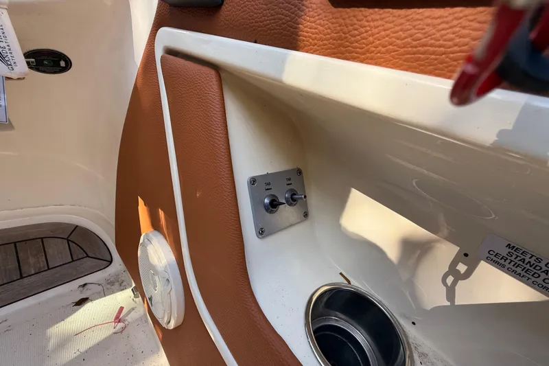 Slide: The Image of 2018 Chris-Craft Capri 27 interior detail with switches and speaker. - 28