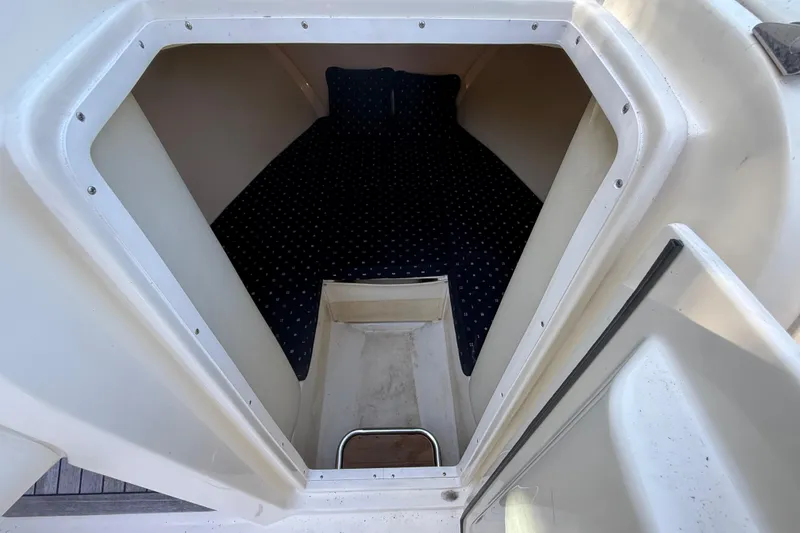 Slide: The Image of 2018 Chris-Craft Capri 27 cabin interior with cozy sleeping area. - 32