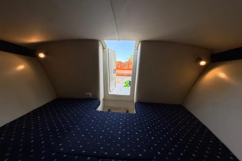 Slide: The Image of Interior cabin of 2018 Chris-Craft Capri 27 with cozy seating and ambient lighting. - 39