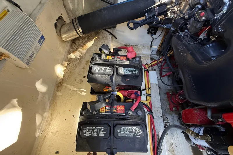 Slide: The Image of Engine compartment of 2018 Chris-Craft Capri 27 with dual batteries and wiring. - 65