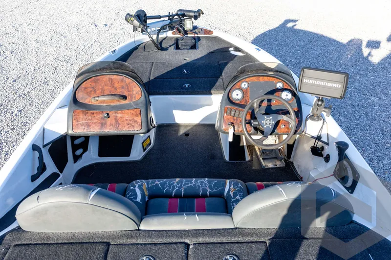 Slide: The Image of 2002 Ranger 185 VS boat interior with steering wheel and Humminbird fish finder. - 28