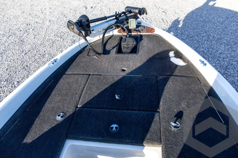 Slide: The Image of 2002 Ranger 185 VS boat deck with trolling motor and carpeted surface. - 30