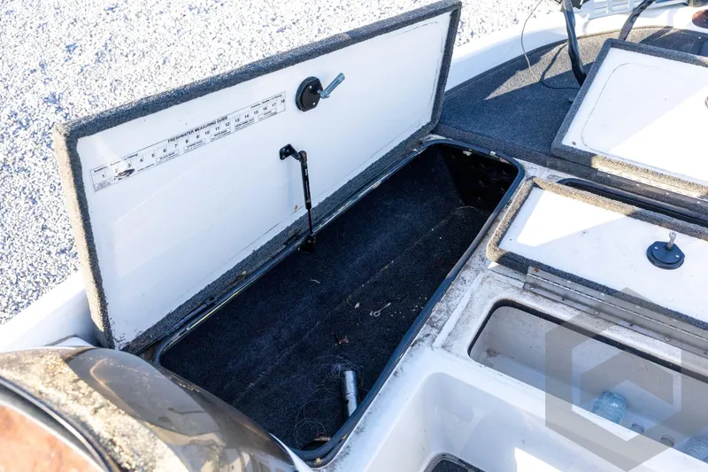 Slide: The Image of Open storage compartments on a 2002 Ranger 185 VS boat deck. - 35