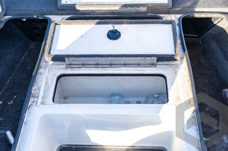 Slide: The Image of 2002 Ranger 185 VS boat storage compartment with water bottles inside. - 36