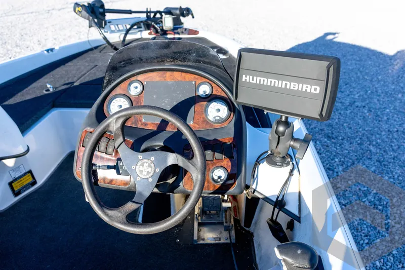 Slide: The Image of 2002 Ranger 185 VS boat dashboard with steering wheel and Humminbird fish finder. - 43