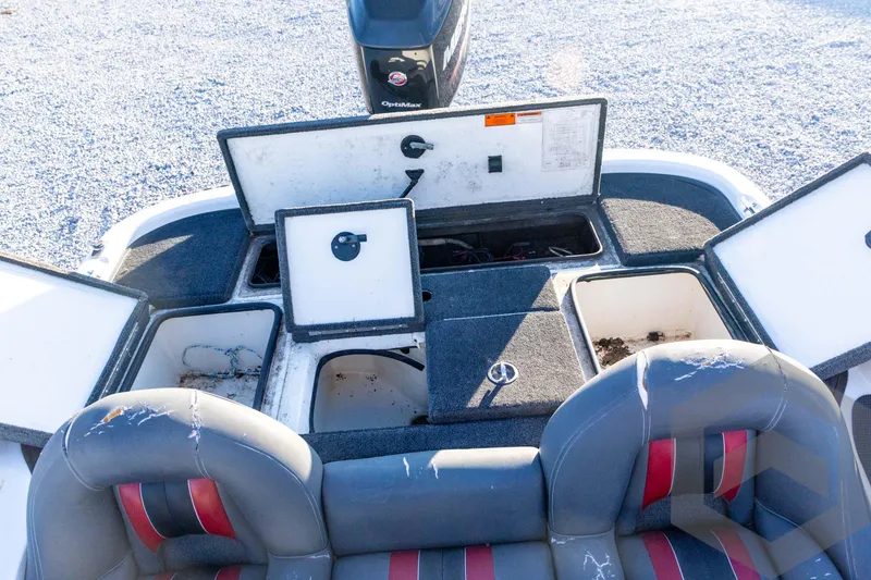 Slide: The Image of 2002 Ranger 185 VS boat interior with open storage compartments and seating. - 52