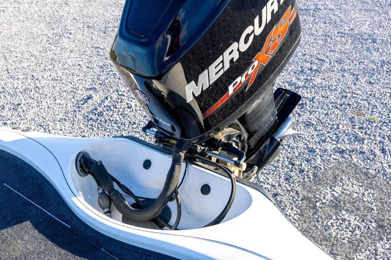 Slide: The Image of 2002 Ranger 185 VS boat with Mercury Pro XS outboard motor on gravel surface. - 58