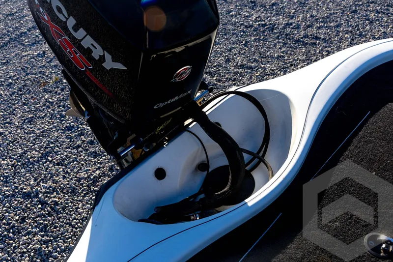 Slide: The Image of 2002 Ranger 185 VS boat with Mercury OptiMax engine on gravel surface. - 59