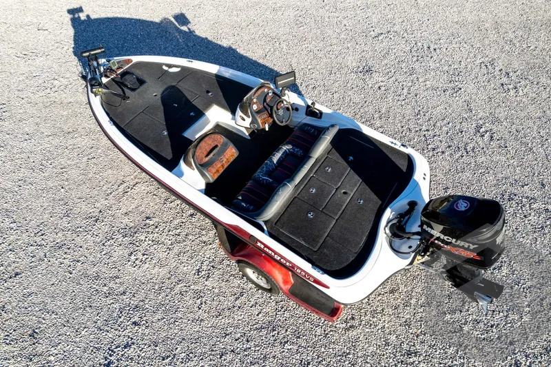 Slide: The Image of 2002 Ranger 185 VS fishing boat with Mercury outboard on gravel surface. - 62