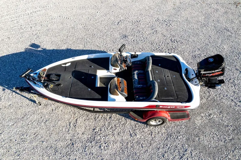 Slide: The Image of 2002 Ranger 185 VS boat on gravel, featuring Mercury outboard motor. - 63