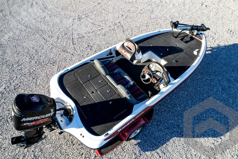 Slide: The Image of 2002 Ranger 185 VS boat with Mercury engine, aerial view on gravel surface. - 68