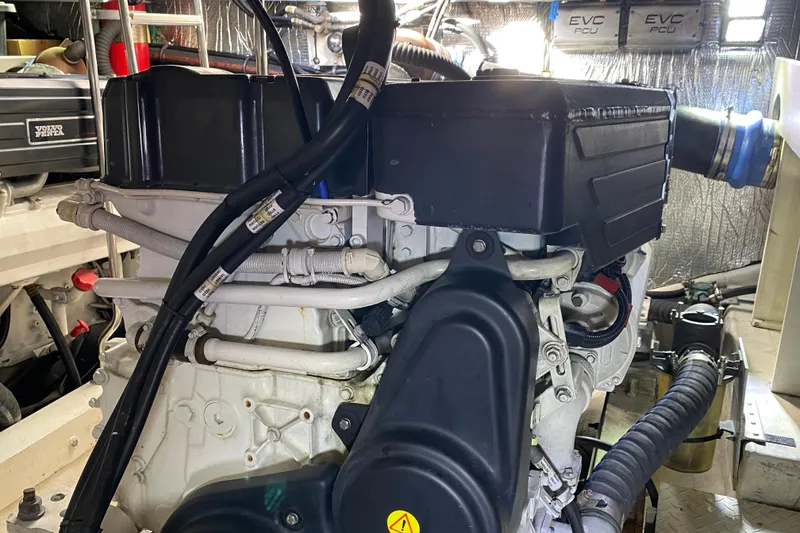 Slide: The Image of Engine room of 2006 Cruisers Yachts 520 Express with labeled storage bins and equipment. - 100