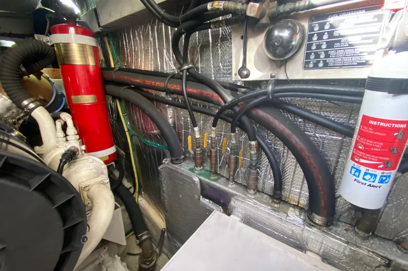 Slide: The Image of Engine room of 2006 Cruisers Yachts 520 Express, showcasing mechanical components. - 109