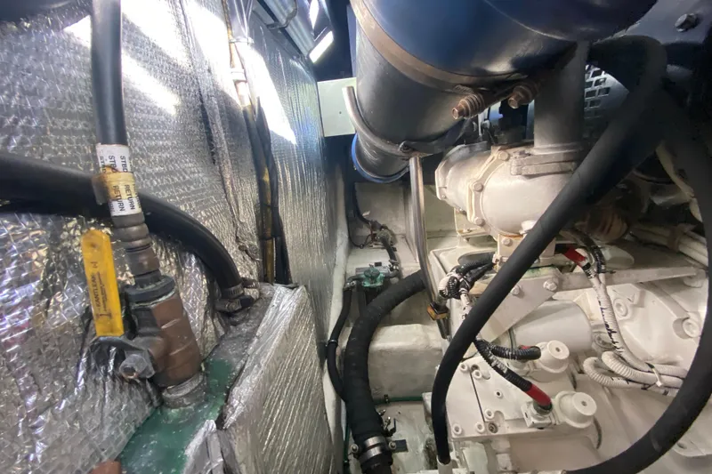 Slide: The Image of Engine room of 2006 Cruisers Yachts 520 Express, showcasing mechanical components. - 110