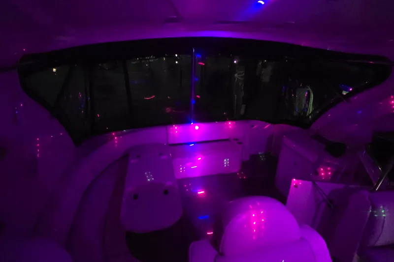 Slide: The Image of Interior of 2006 Cruisers Yachts 520 Express with ambient purple lighting. - 23