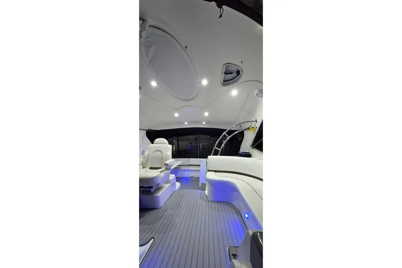 Slide: The Image of Interior of 2006 Cruisers Yachts 520 Express with modern seating and ambient lighting. - 24