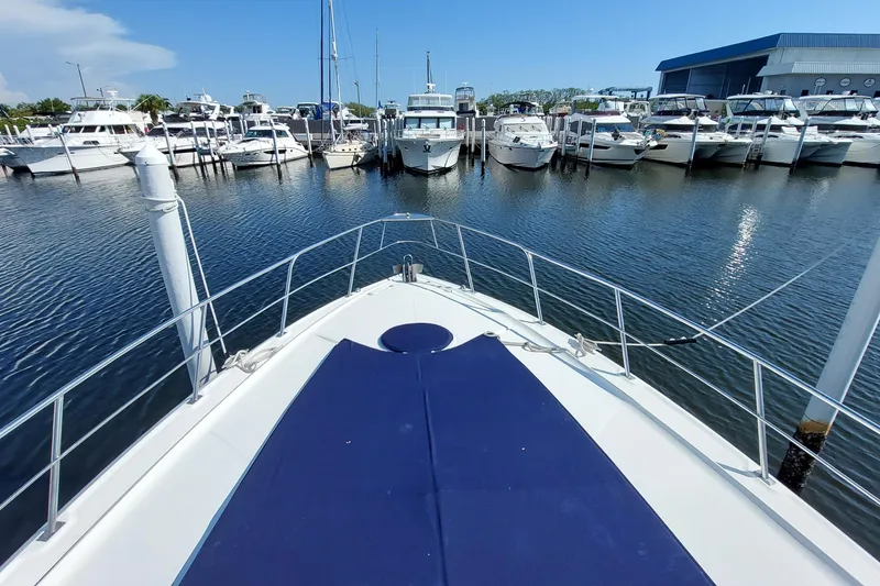 Slide: The Image of Luxurious interior of 2006 Cruisers Yachts 520 Express with white seating and modern lighting. - 37