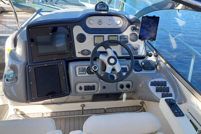 Slide: The Image of Interior view of 2006 Cruisers Yachts 520 Express with panoramic windows and luxurious seating. - 38