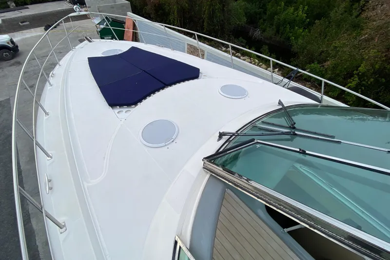 Slide: The Image of Luxurious interior of 2006 Cruisers Yachts 520 Express with modern kitchen and comfortable seating. - 56