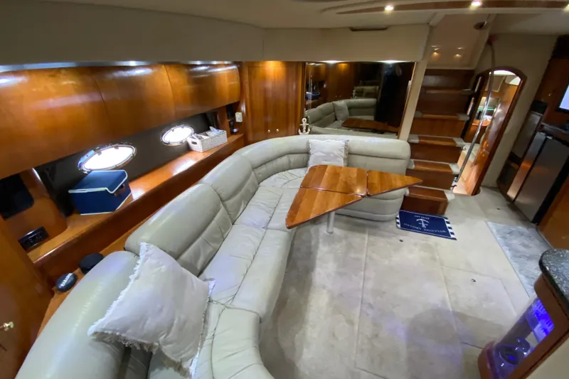 Slide: The Image of Luxurious 2006 Cruisers Yachts 520 Express interior with illuminated liquor cabinet. - 65