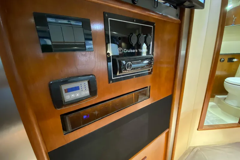 Slide: The Image of Luxurious 2006 Cruisers Yachts 520 Express interior with elegant bathroom and cozy bedroom. - 84