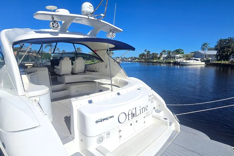 Slide: The Image of 2006 Cruisers Yachts 520 Express docked on a sunny waterfront. - 9