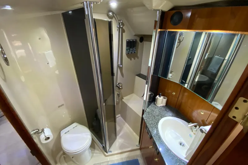 Slide: The Image of Engine room of 2006 Cruisers Yachts 520 Express with mechanical components and wiring. - 94