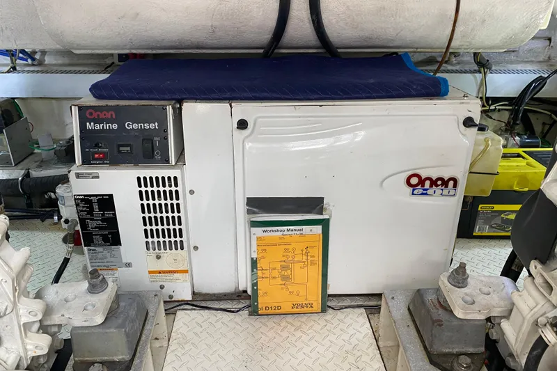 Slide: The Image of Engine room of 2006 Cruisers Yachts 520 Express with mechanical components and wiring. - 96