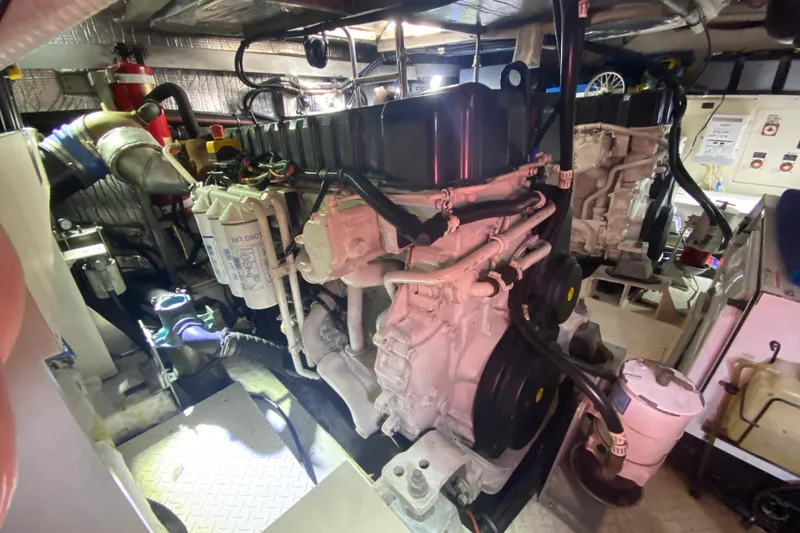 Slide: The Image of Engine room of 2006 Cruisers Yachts 520 Express with fire extinguisher and fuel lines. - 103