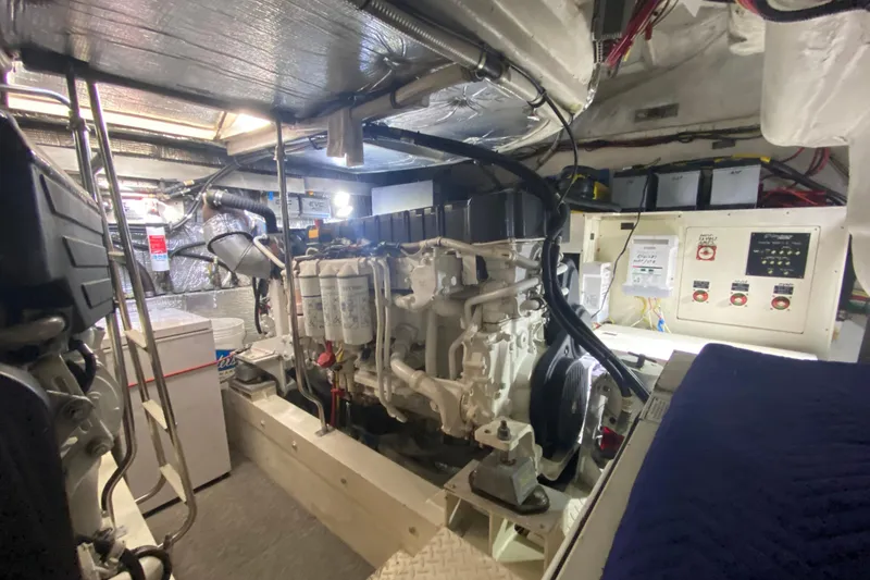 Slide: The Image of Open freezer in 2006 Cruisers Yachts 520 Express engine room, with surrounding equipment. - 104