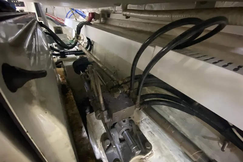 Slide: The Image of Engine room of 2006 Cruisers Yachts 520 Express, showcasing equipment and wiring. - 106