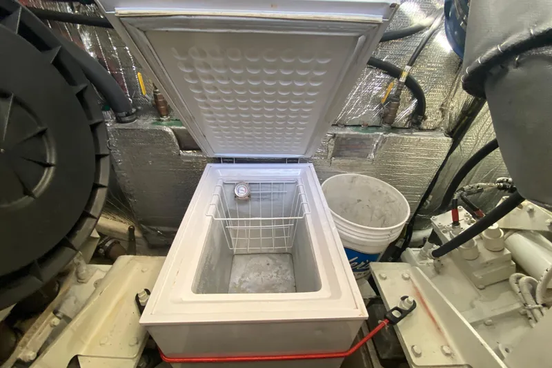 Slide: The Image of 2006 Cruisers Yachts 520 Express engine room with control panels and equipment. - 108