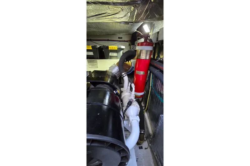 Slide: The Image of 2006 Cruisers Yachts 520 Express, sleek design, docked under clear blue sky. - 28