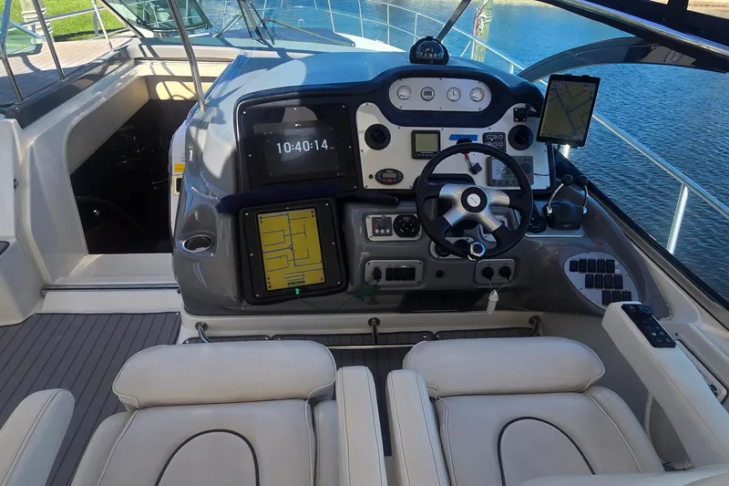 Slide: The Image of 2006 Cruisers Yachts 520 Express hull on blocks, showcasing underside details. - 41