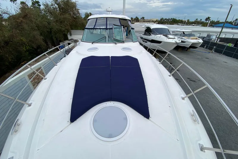 Slide: The Image of Luxurious interior of 2006 Cruisers Yachts 520 Express with plush seating and elegant wood finishes. - 54