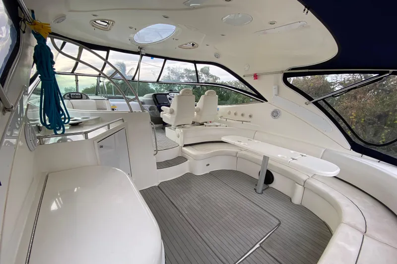 Slide: The Image of Luxurious 2006 Cruisers Yachts 520 Express kitchen with modern appliances and sleek wood cabinetry. - 58