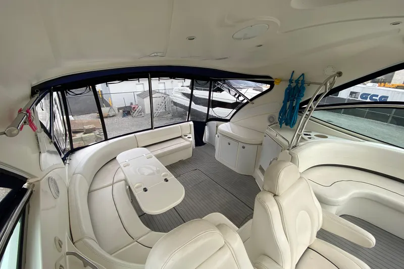 Slide: The Image of 2006 Cruisers Yachts 520 Express kitchen with stainless steel appliances and wood cabinetry. - 61