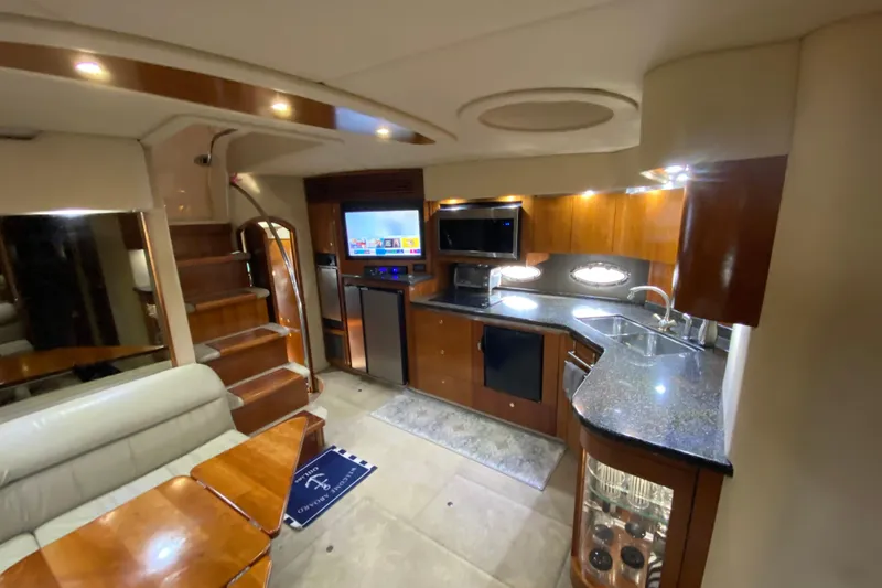 Slide: The Image of Electrical control panel inside 2006 Cruisers Yachts 520 Express, featuring switches and generator controls. - 64