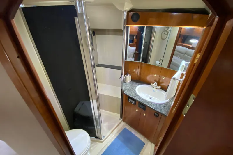 Slide: The Image of Engine room of 2006 Cruisers Yachts 520 Express, showcasing mechanical components and systems. - 91