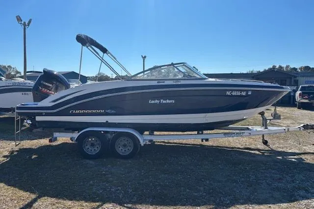 Slide: The Image of 2018 Chaparral 230 Suncoast boat on trailer under clear blue sky. - 5